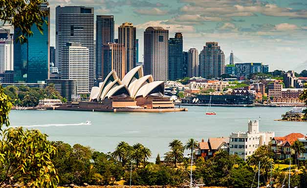 Landscape aerial view of Sydney Opera house near Sydney business center around the harbour.